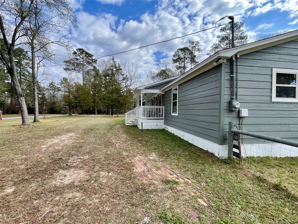 2504 Davisville Road Lufkin, TX 75901 - Photo 19 of 26 a backyard of a house with lots of green space
