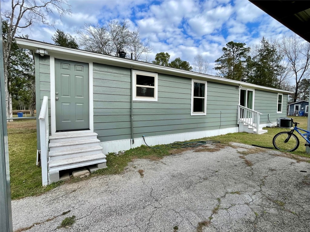 2504 Davisville Road Lufkin, TX 75901 - Photo 20 of 26 a view of a small house with a patio