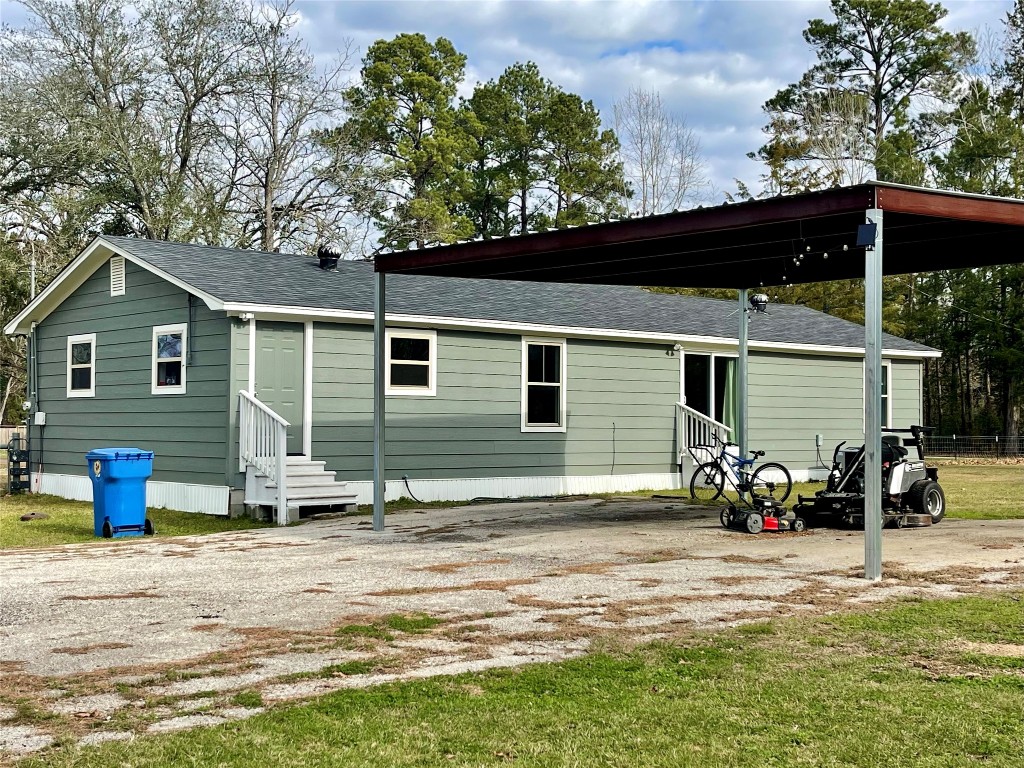 2504 Davisville Road Lufkin, TX 75901 - Photo 21 of 26 a backyard of a house with table and chairs