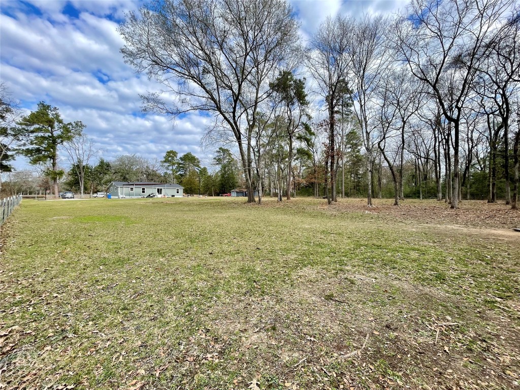 2504 Davisville Road Lufkin, TX 75901 - Photo 23 of 26 a view of a field with trees in the background