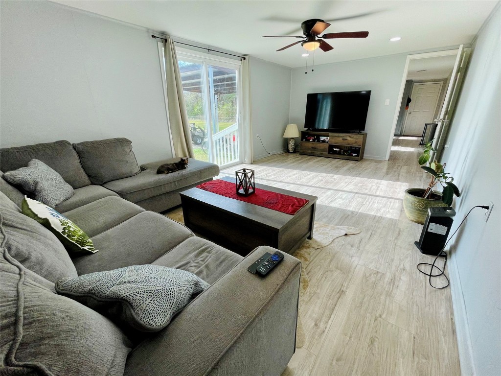2504 Davisville Road Lufkin, TX 75901 - Photo 8 of 26 a living room with furniture and a flat screen tv