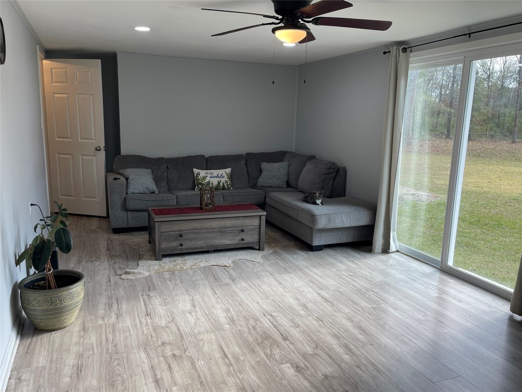 2504 Davisville Road Lufkin, TX 75901 - Photo 9 of 26 a living room with furniture and a potted plant