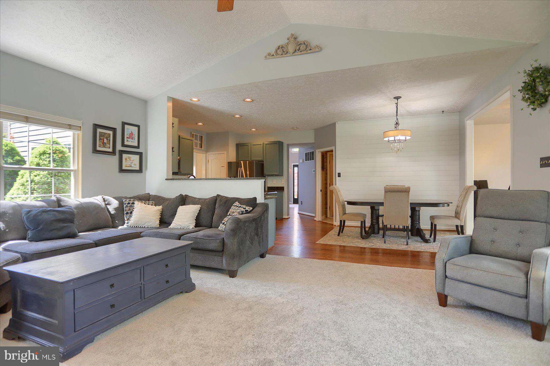 631 Prestwick Trail Bel Air, MD 21014 - Photo 14 of 64 a living room with furniture and a chandelier