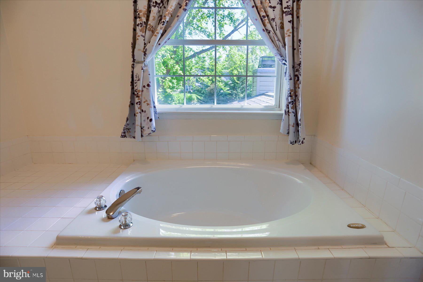 631 Prestwick Trail Bel Air, MD 21014 - Photo 33 of 64 a white bath tub sitting in a bathroom next to a window