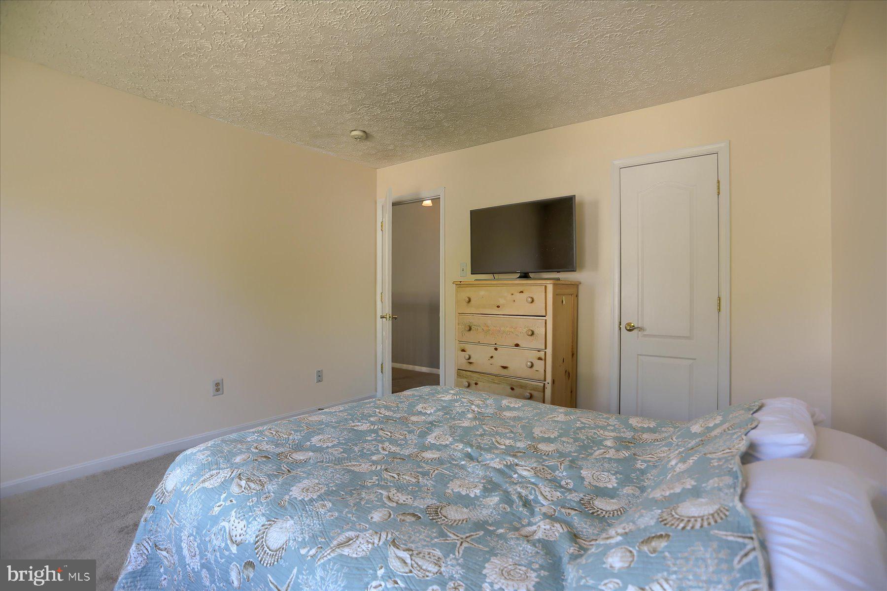 631 Prestwick Trail Bel Air, MD 21014 - Photo 35 of 64 a bedroom with a bed and a flat screen tv