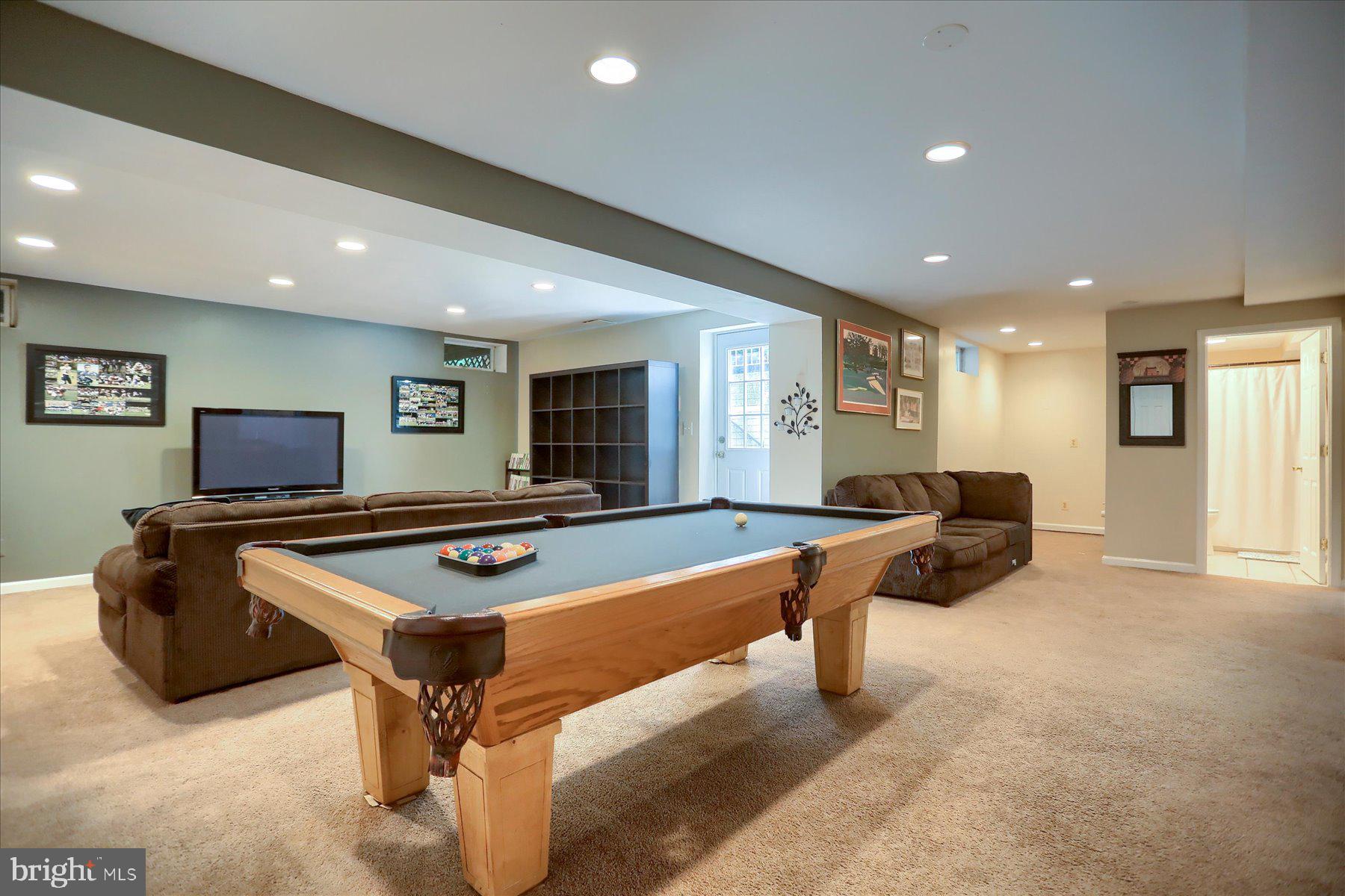 631 Prestwick Trail Bel Air, MD 21014 - Photo 41 of 64 a living room with furniture pool table and a flat screen tv