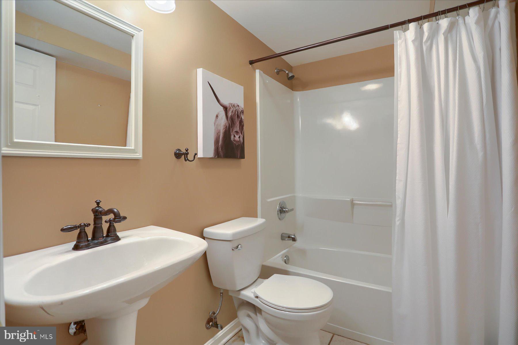 631 Prestwick Trail Bel Air, MD 21014 - Photo 45 of 64 a bathroom with a sink toilet and shower