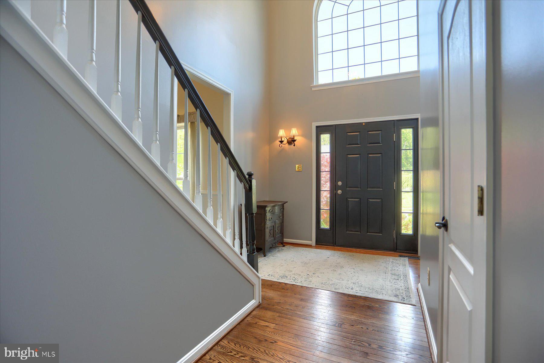631 Prestwick Trail Bel Air, MD 21014 - Photo 5 of 64 a view of a hallway with wooden floor and staircase