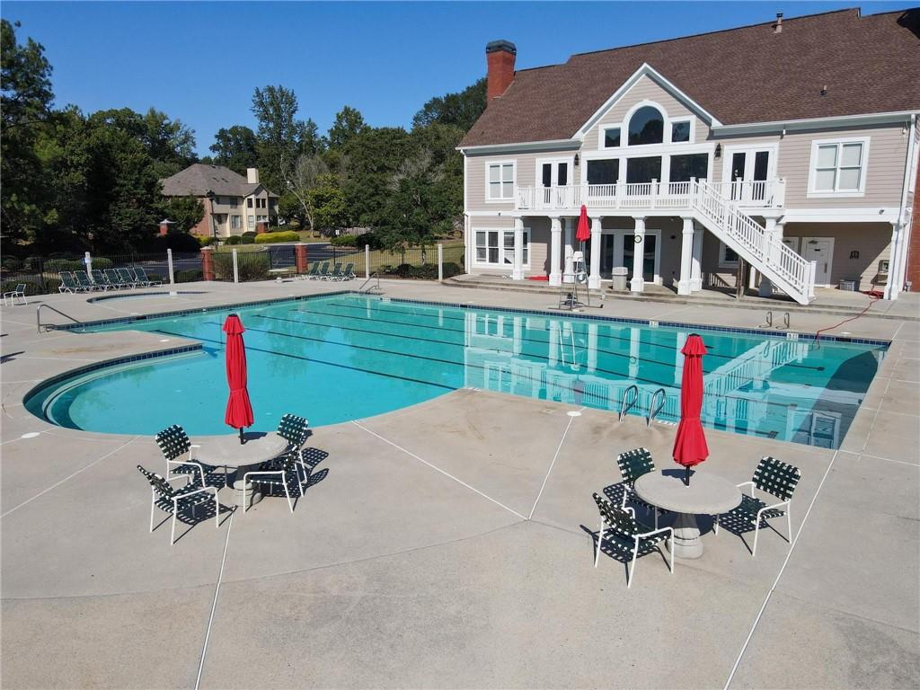 4055 Vista Point Lane Suwanee, GA 30024 - Photo 39 of 42 a house view with a garden and outdoor seating