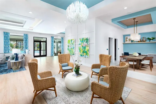 a living room with furniture chandelier and a chandelier