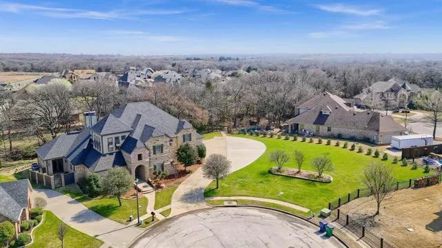 an aerial view of a house with a swimming pool