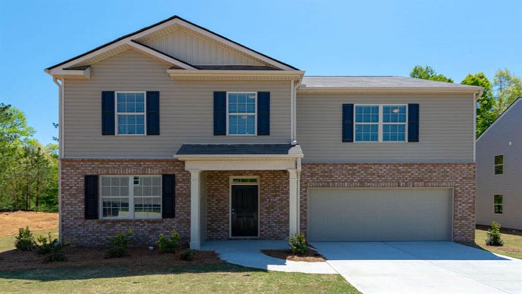 262 Ralph Still Road Dacula, GA 30019 - Photo 1 of 1 a front view of a house with garden