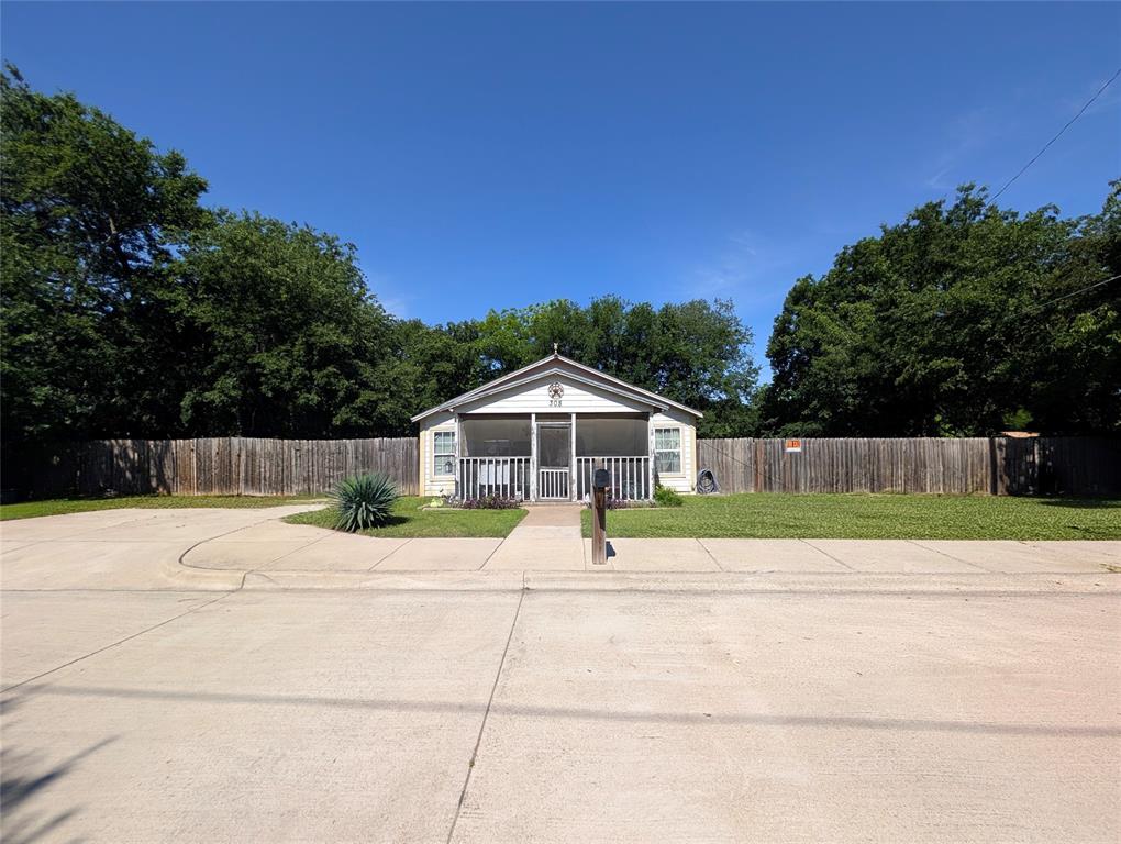 308 Short Street Mansfield, TX 76063 - Photo 1 of 21 a white house with a yard and wooden fence