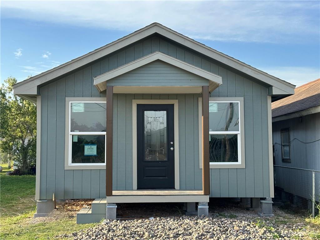 415 West Pablo Layton Street Elsa, TX 78543 - Photo 2 of 14 a front view of a house with a yard