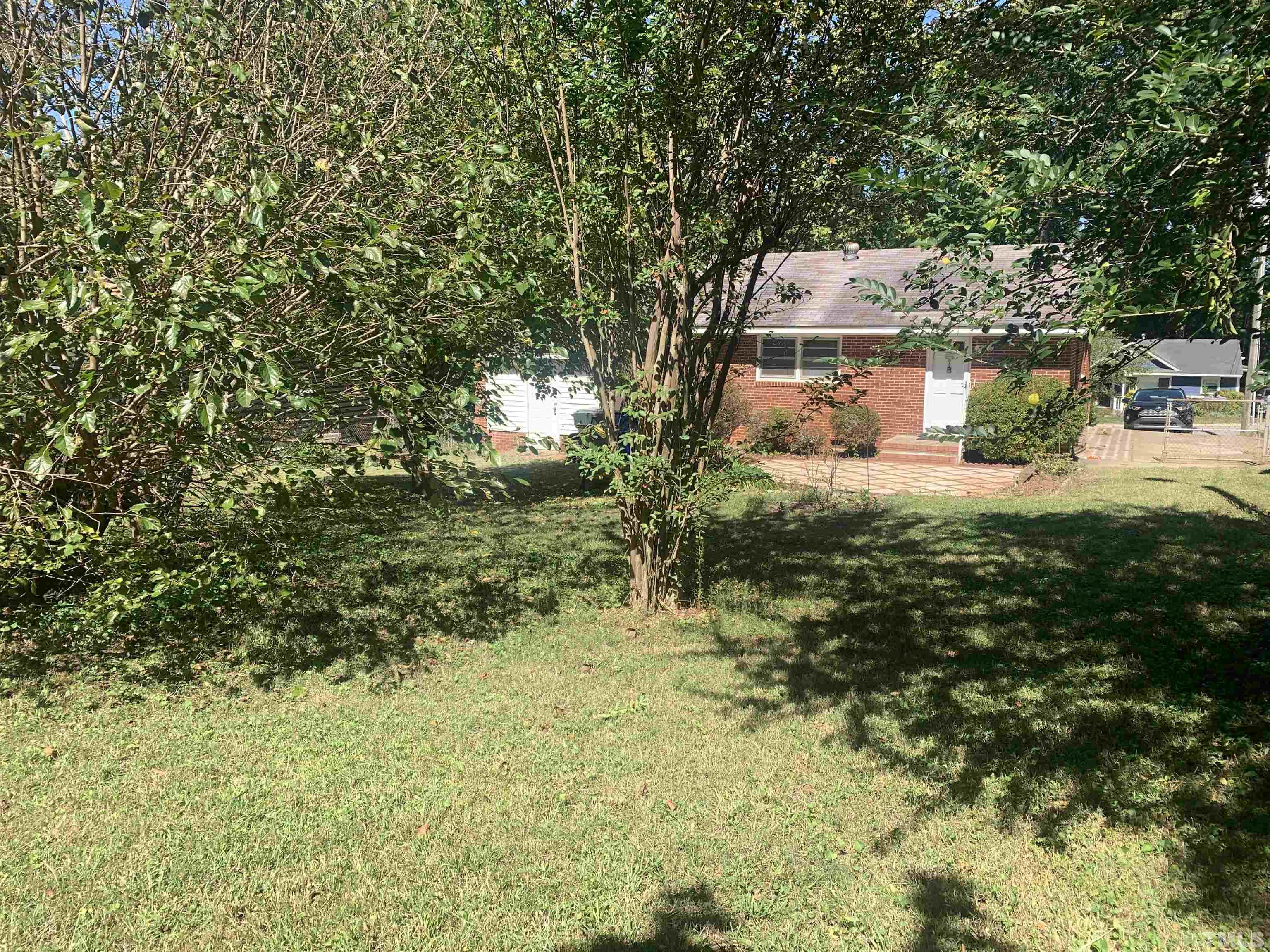 2312 Sheffield Road Raleigh, NC 27610 - Photo 3 of 3 a view of a house with a yard