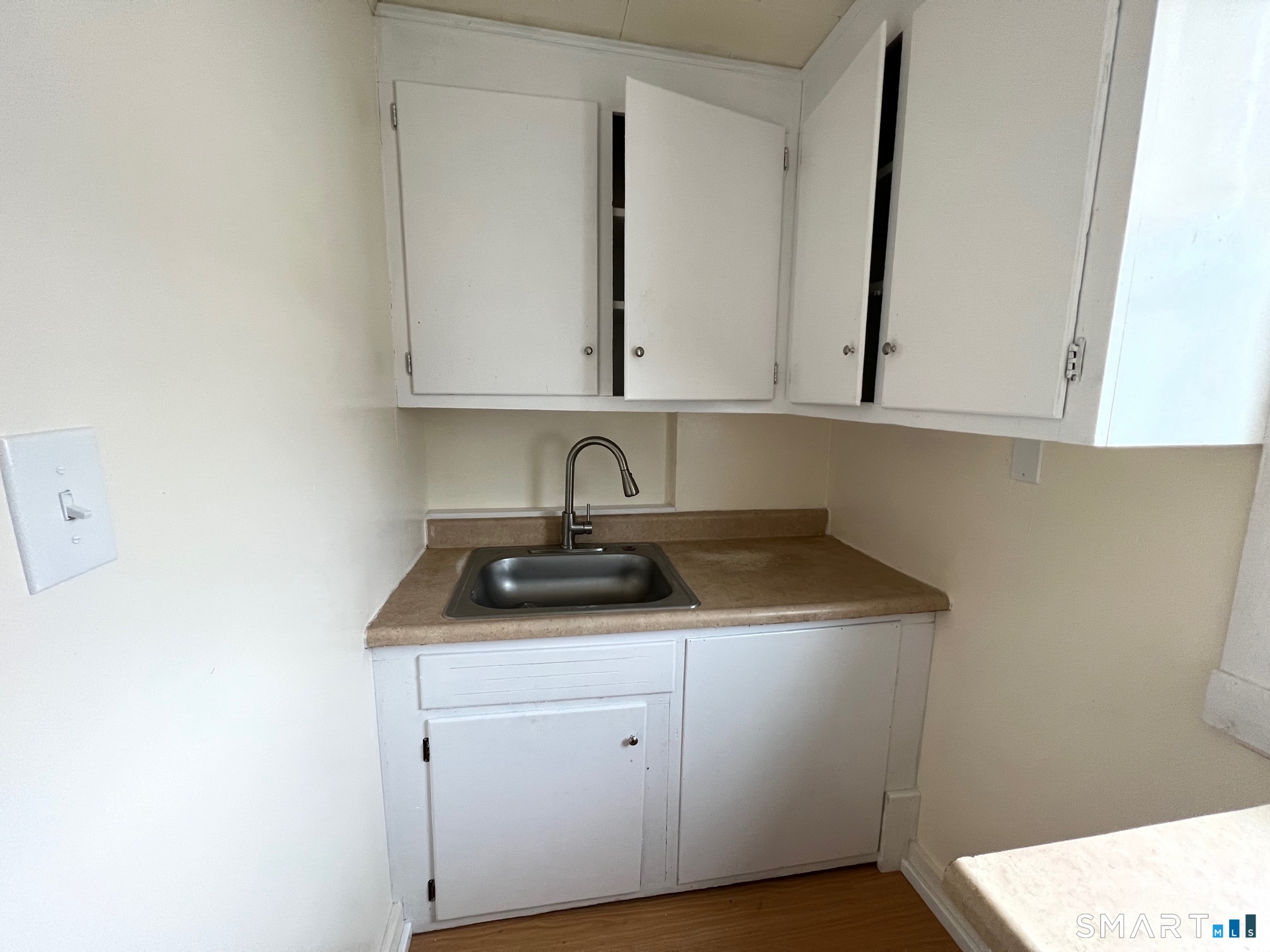 62 North Leonard Street Waterbury, CT 06708 - Photo 5 of 13 a bathroom with a sink and a mirror