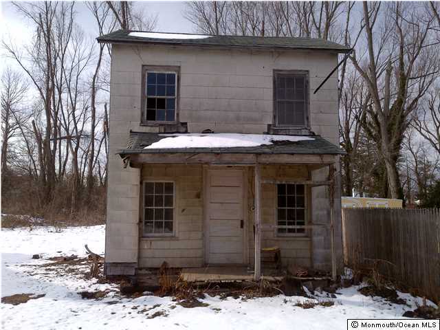 4 Clayton Avenue Howell, NJ 07710 - Photo 2 of 2 a front view of a house with a yard
