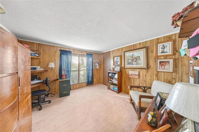 a bedroom with furniture and a window