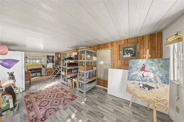 a bedroom with furniture and a book shelf