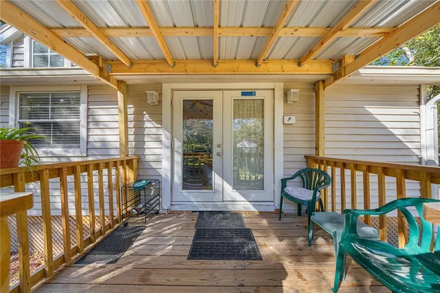 a front view of a house with outdoor seating