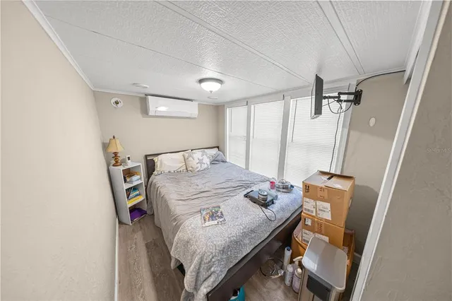 a bedroom with a bed and a mirror