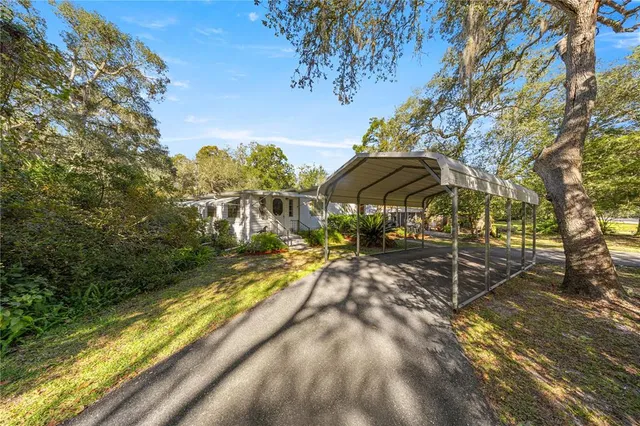 a view of swimming pool with sitting area