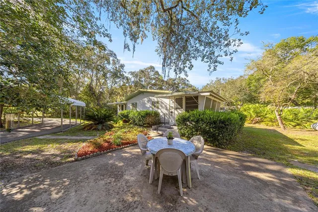 a view of a yard with patio
