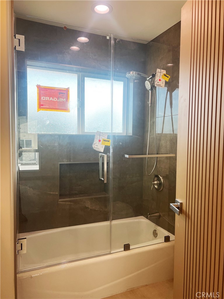 1514 East Woodbury Road, Unit 1/2 Pasadena, CA 91104 - Photo 11 of 14 a bathroom with a bathtub and shower