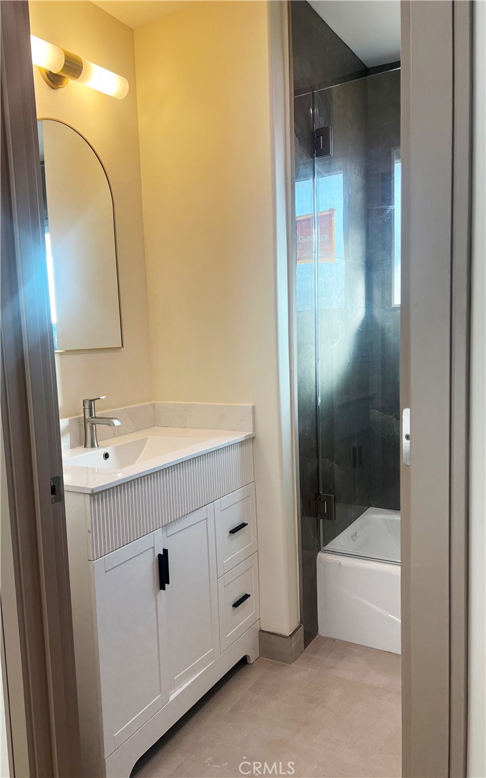 1514 East Woodbury Road, Unit 1/2 Pasadena, CA 91104 - Photo 13 of 14 a bathroom with a sink a toilet and shower