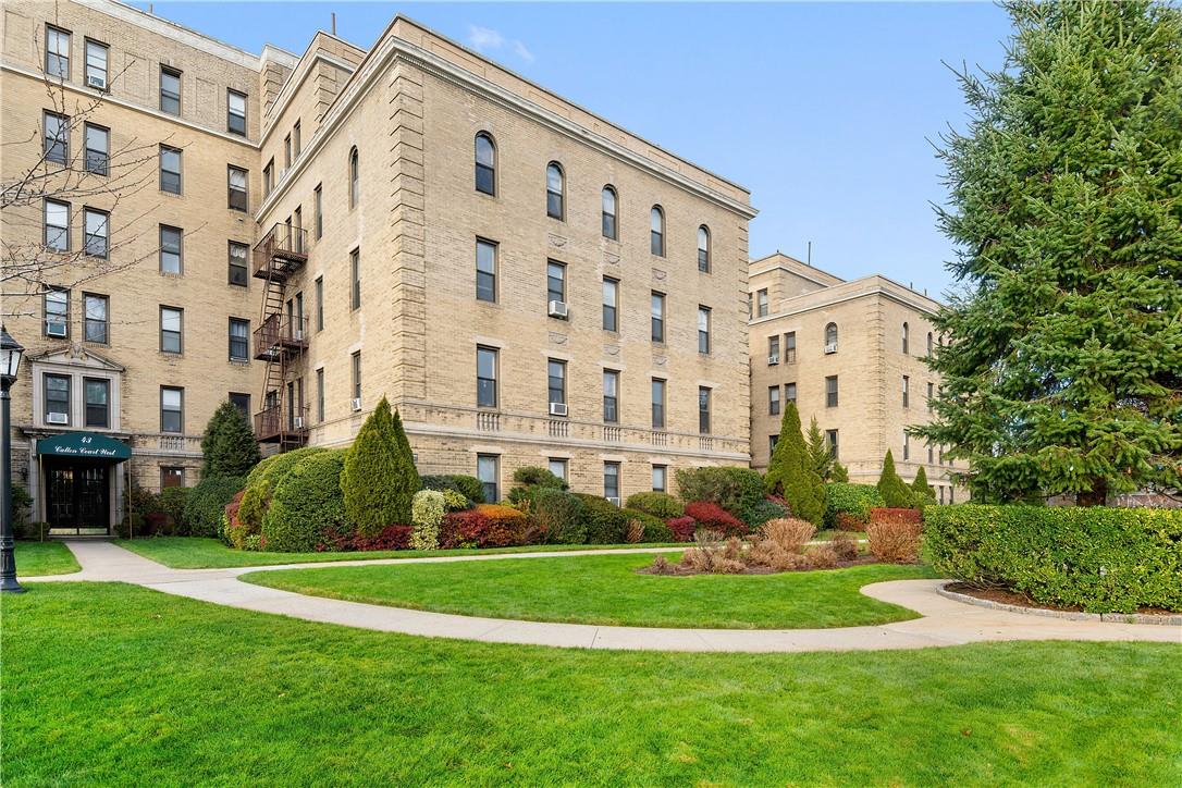 43 Calton Road, Unit 4K New Rochelle, NY 10804 - Photo 1 of 1 a view of a big building with a yard and plants
