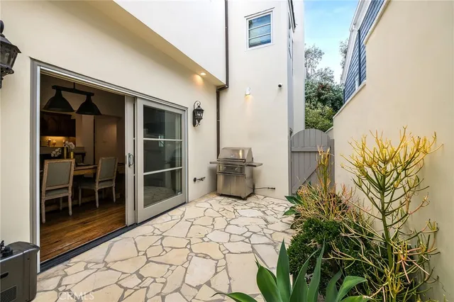 a view of a dining room with furniture a rug and wooden floor