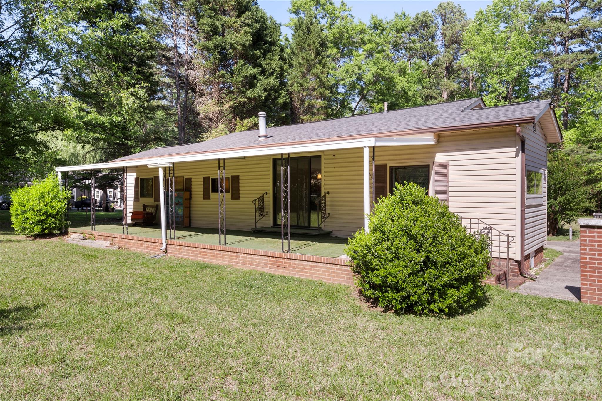 5208 Hickory Grove Road Mount Holly, NC 28120 - Photo 2 of 44 front view of a house with a yard