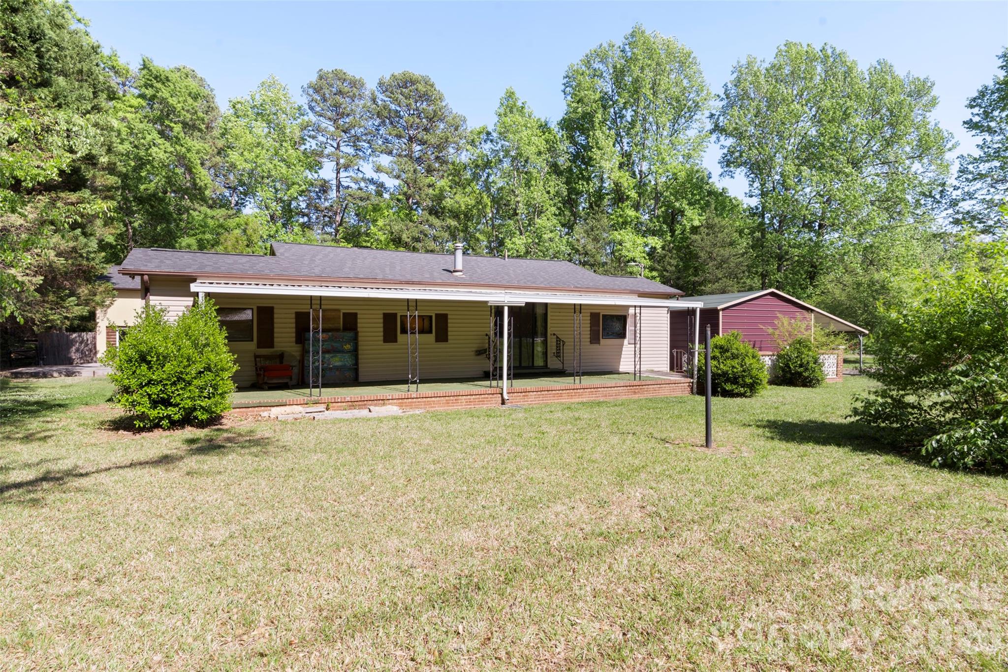5208 Hickory Grove Road Mount Holly, NC 28120 - Photo 42 of 44 a front view of house with yard and green space