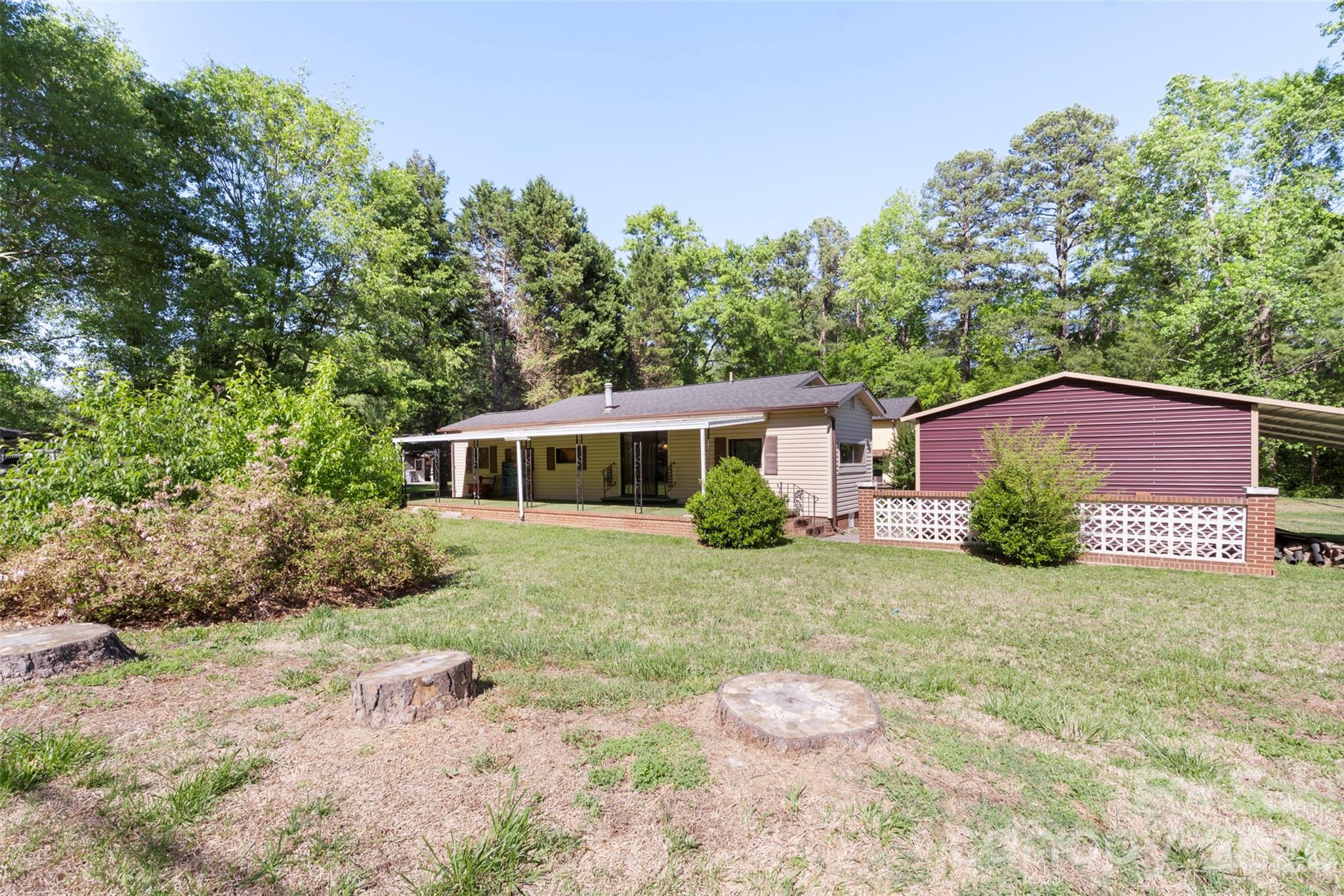 5208 Hickory Grove Road Mount Holly, NC 28120 - Photo 43 of 44 a front view of a house with a garden