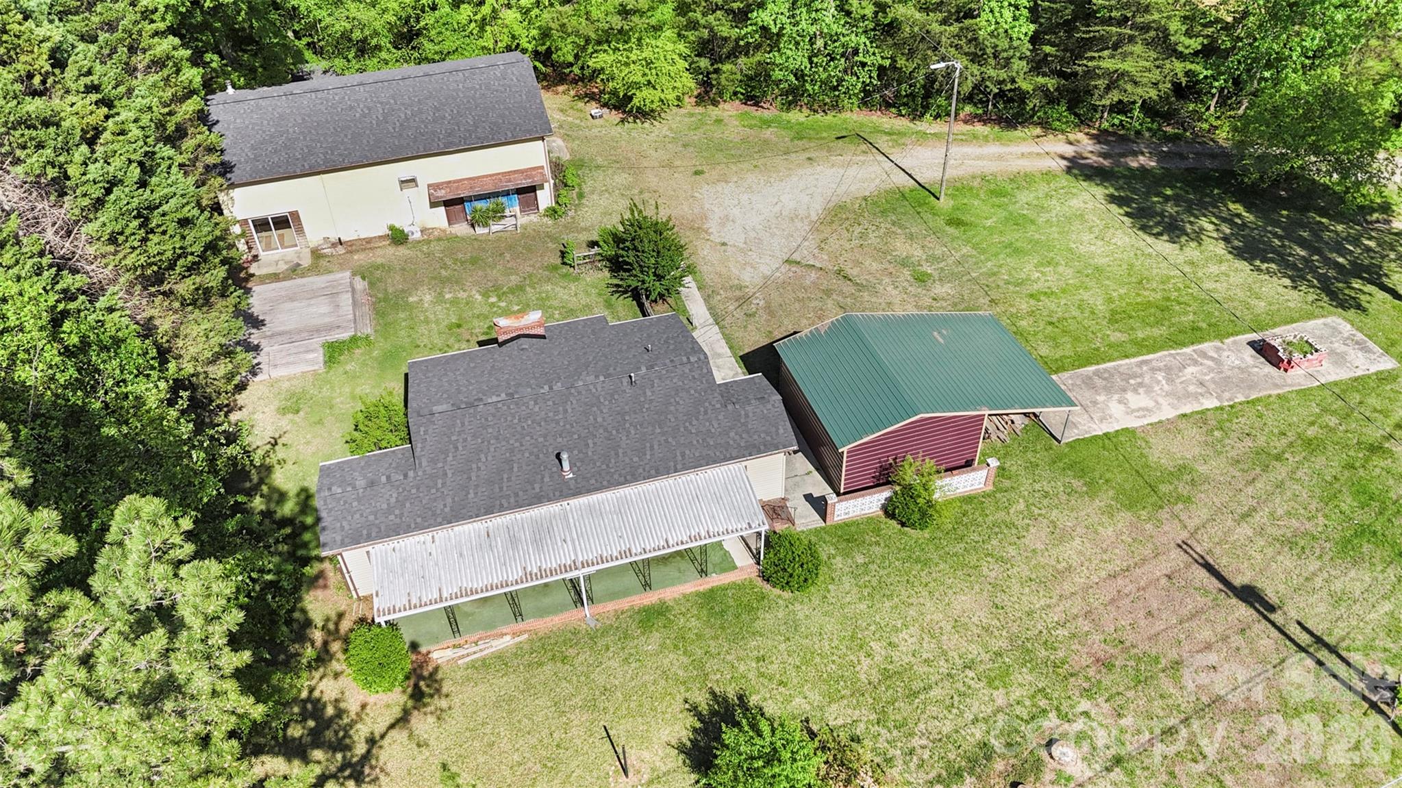 5208 Hickory Grove Road Mount Holly, NC 28120 - Photo 5 of 44 an aerial view of a house with pool and garden