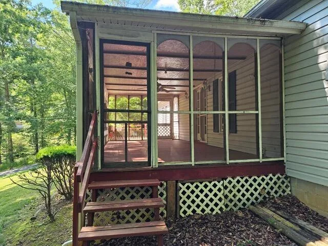 a view of porch and floor to ceiling window