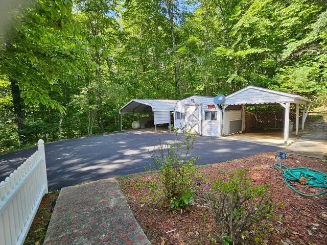 a view of a chair and table in the garden