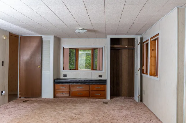 a view of front door with balcony