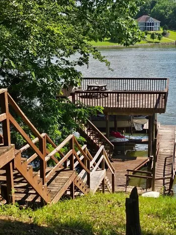 a view of a chairs setting on the roof deck