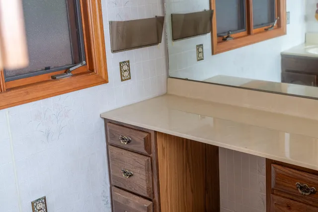 a bathroom with a toilet a sink and tub
