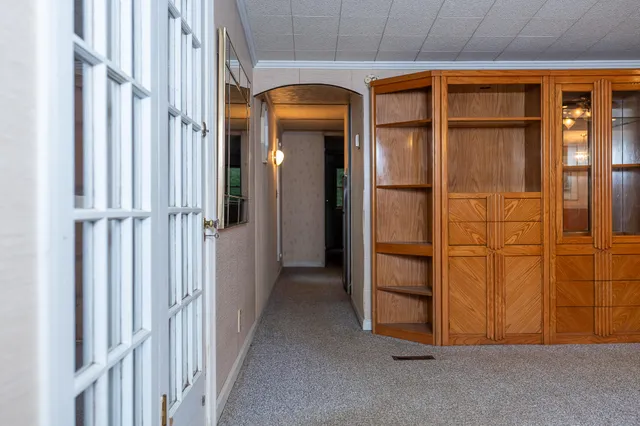 a kitchen with stainless steel appliances a stove a sink and a microwave