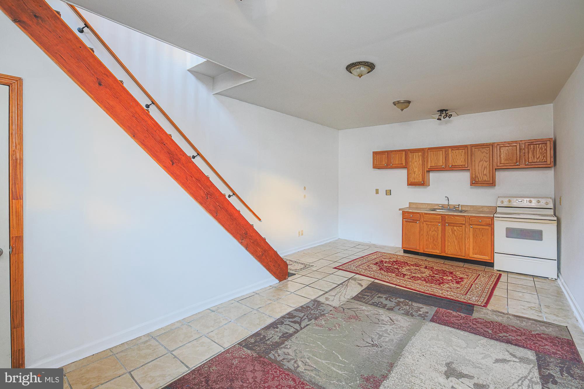 1447 William Street Baltimore, MD 21230 - Photo 14 of 72 a living room with a rug and a stove