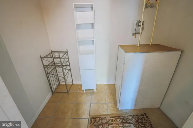 a view of an empty room window and wooden floor