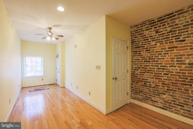 a kitchen with granite countertop stainless steel appliances a refrigerator a sink and a counter top space