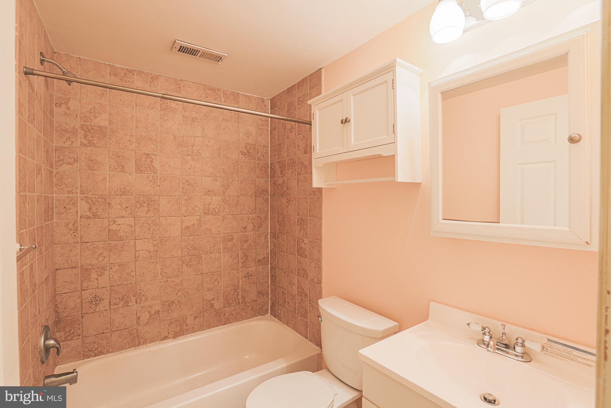 1447 William Street Baltimore, MD 21230 - Photo 33 of 72 a bathroom with a sink toilet and shower