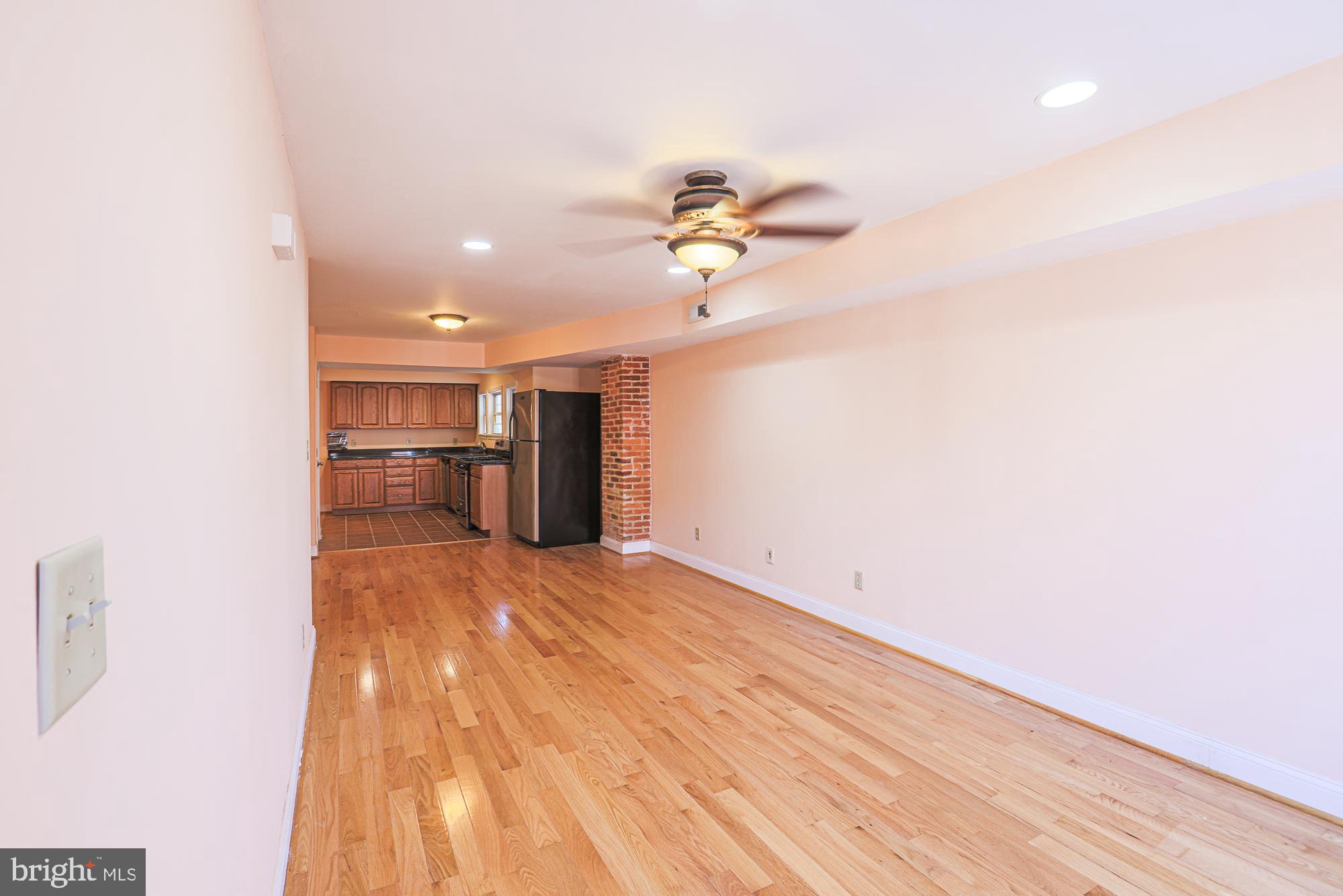 1447 William Street Baltimore, MD 21230 - Photo 39 of 72 a view of empty room with wooden floor and fan