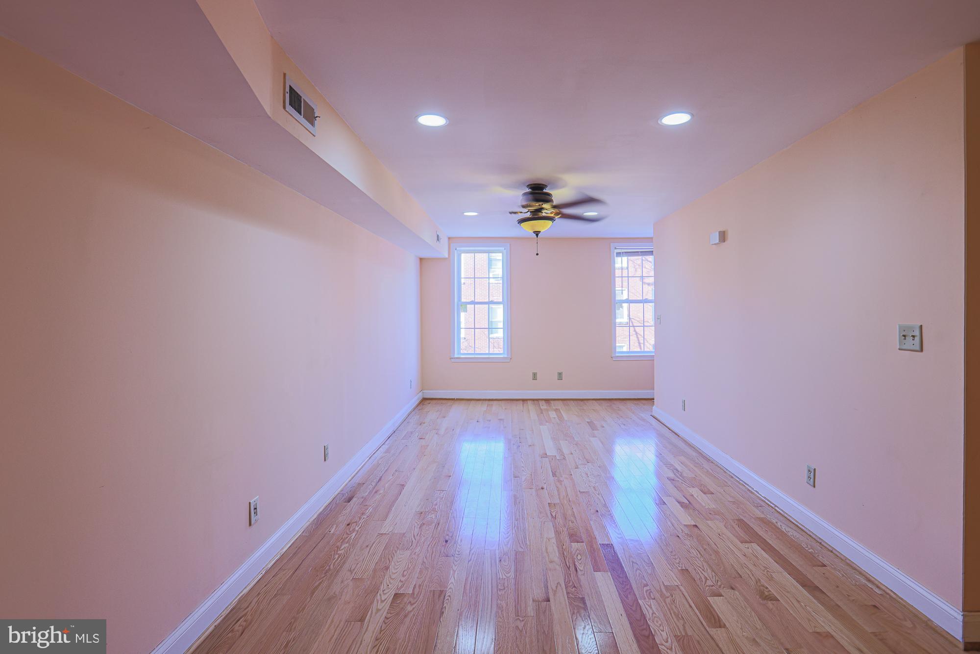 1447 William Street Baltimore, MD 21230 - Photo 41 of 72 a view of an empty room window and wooden floor