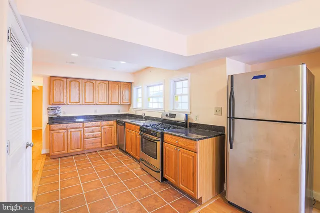 a bathroom with a blue toilet and a shower