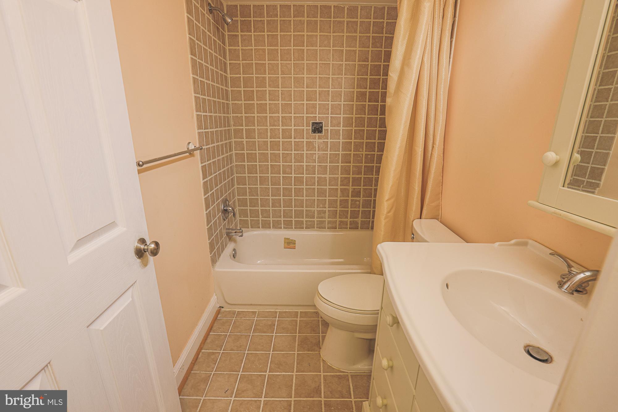 1447 William Street Baltimore, MD 21230 - Photo 50 of 72 a bathroom with a sink toilet and shower