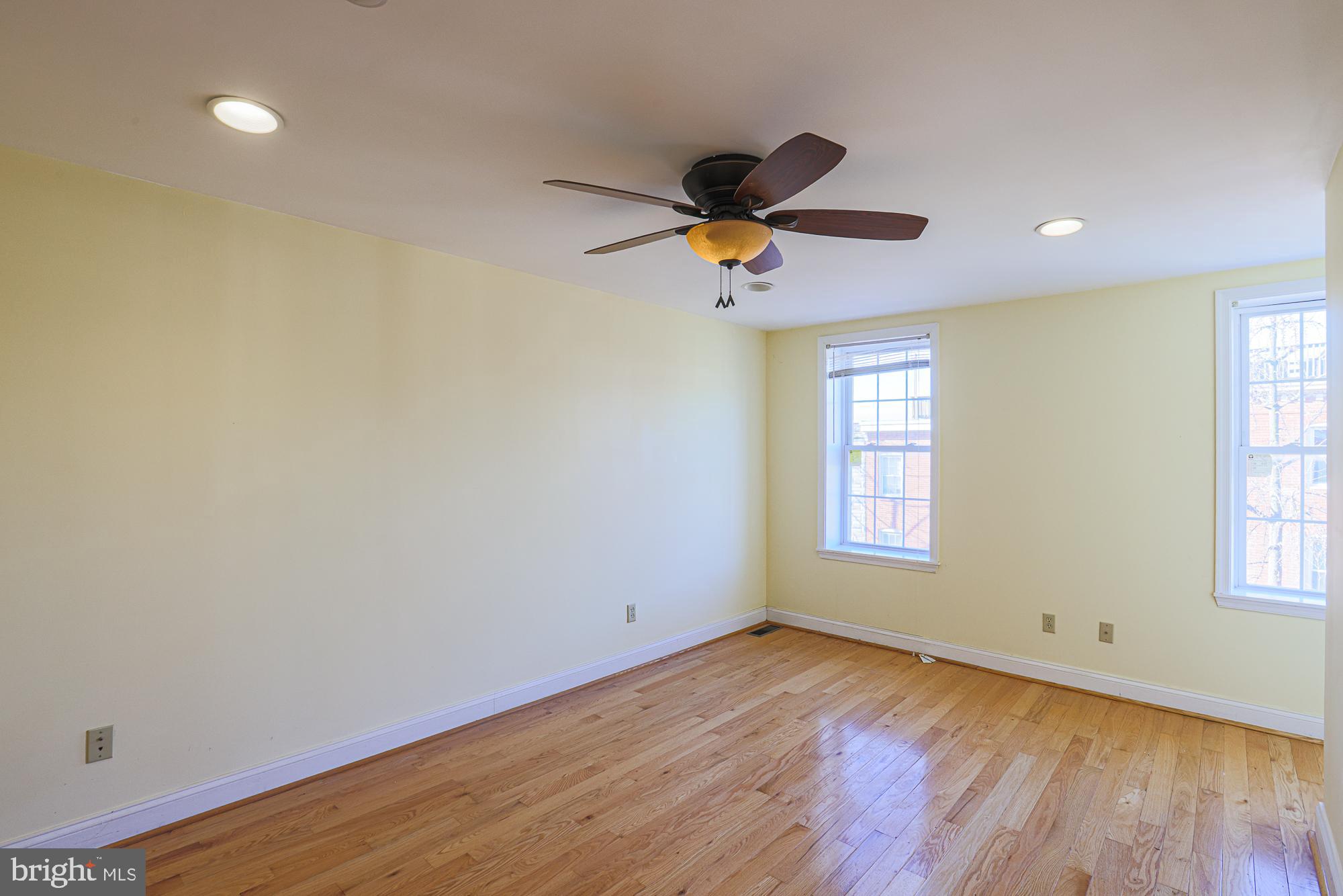 1447 William Street Baltimore, MD 21230 - Photo 53 of 72 an empty room with a window and a ceiling fan